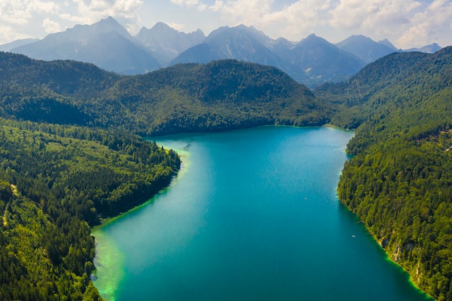 Aerial view on Alpsee lake, Bavaria, Germany. Concept of traveling and hiking in German Alps